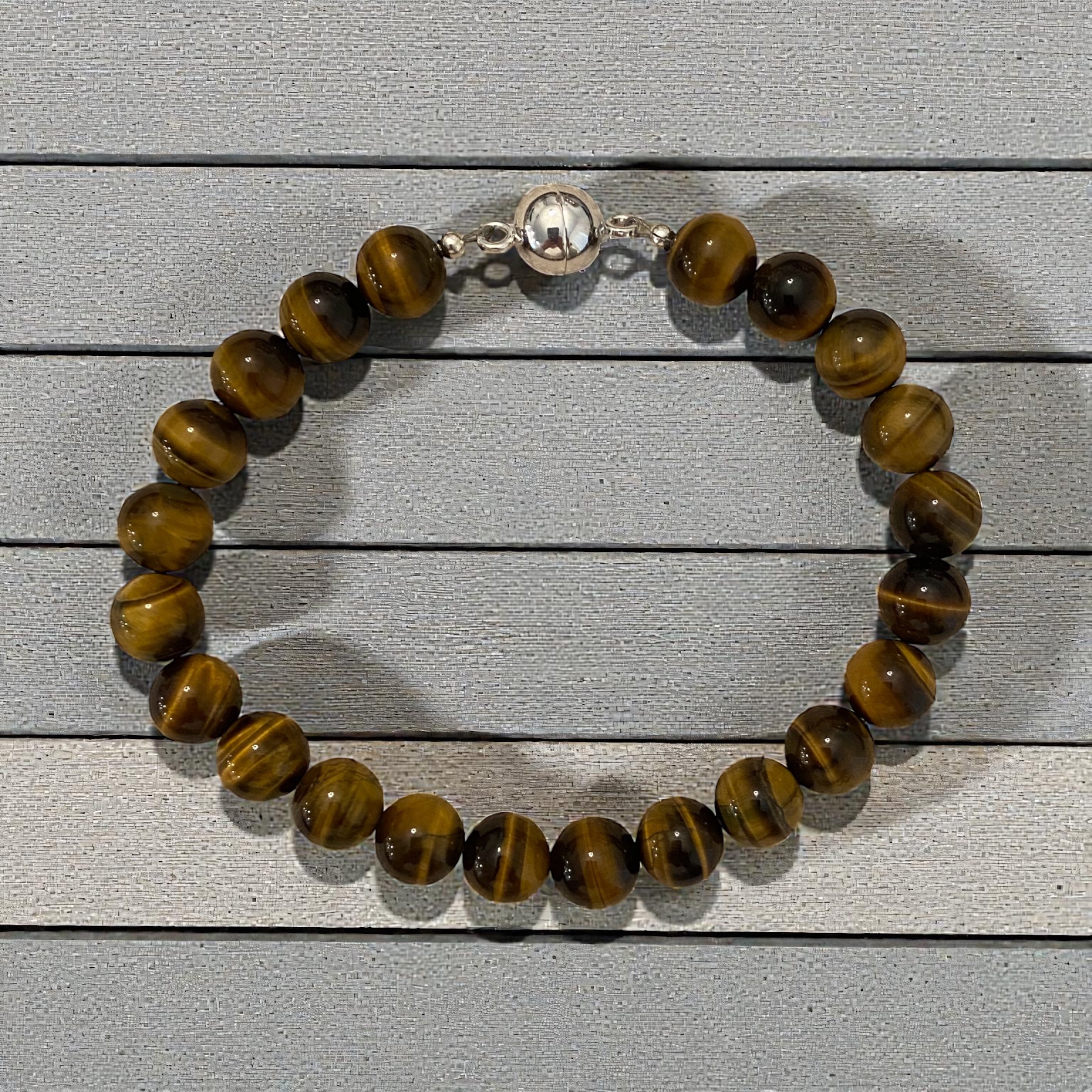Men's bracelet with tiger's eye stones with sterling silver magnetic clasp.