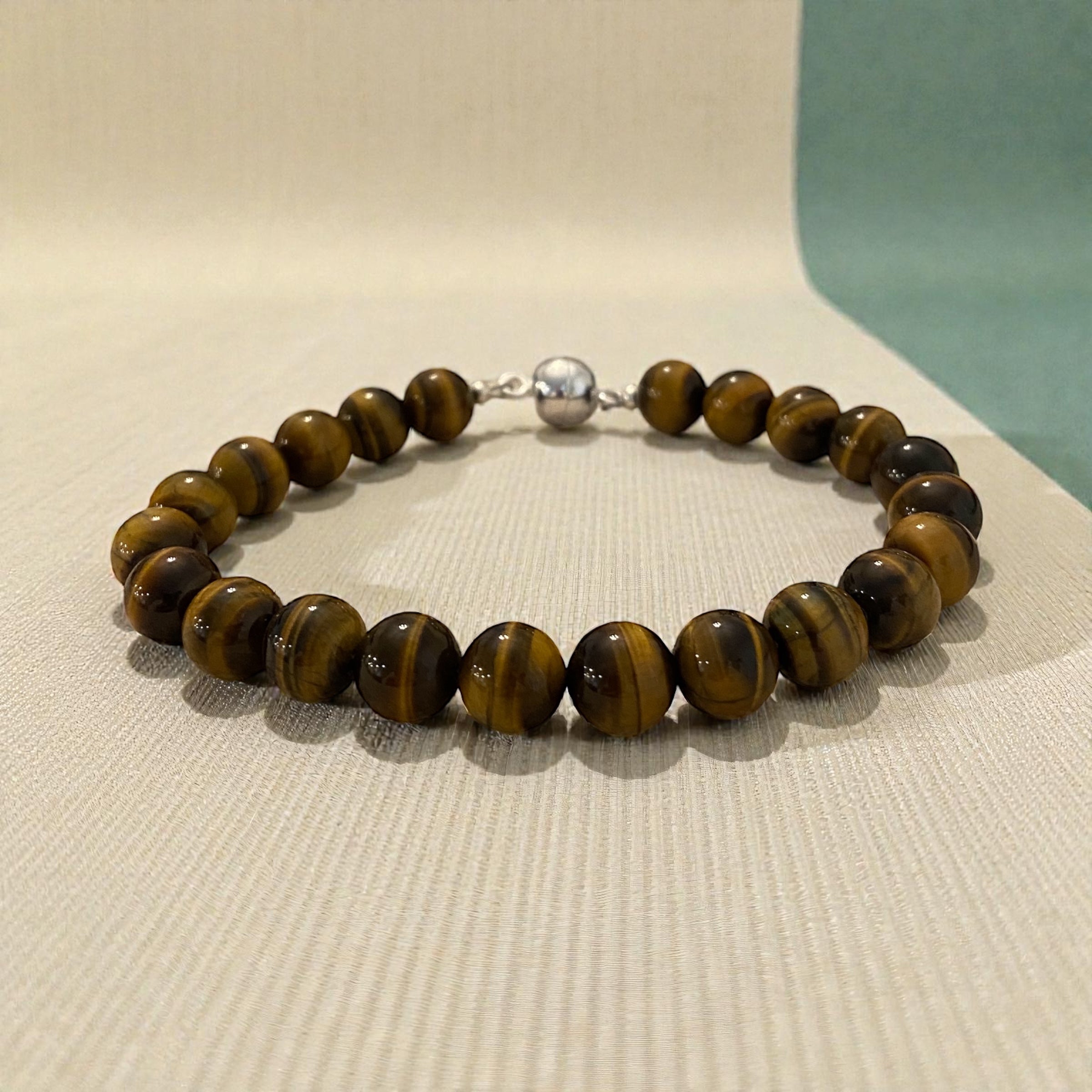 Brown beaded bracelet with a silver clasp.
