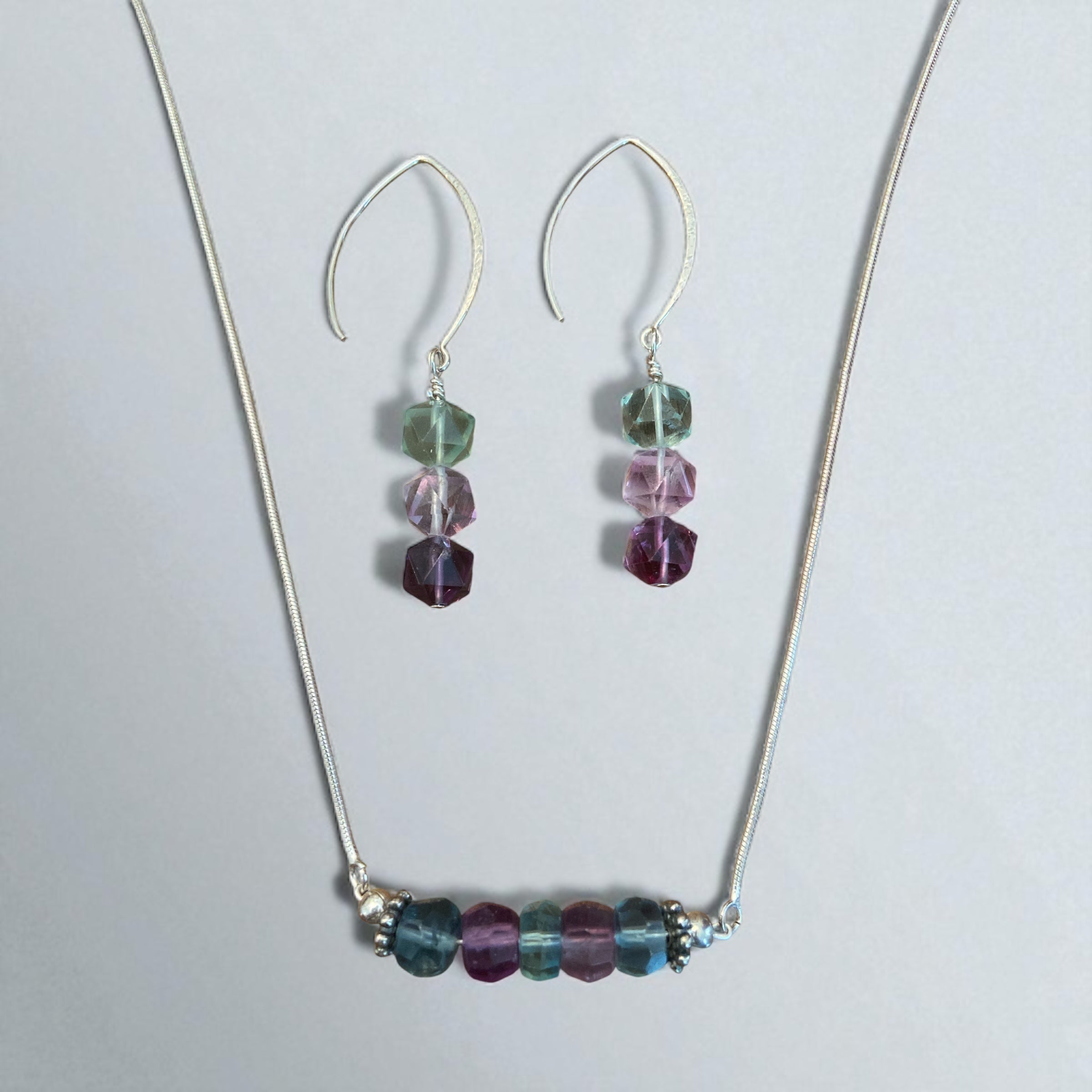 Jewelry set with necklace and earrings featuring multicolored fluorite beads