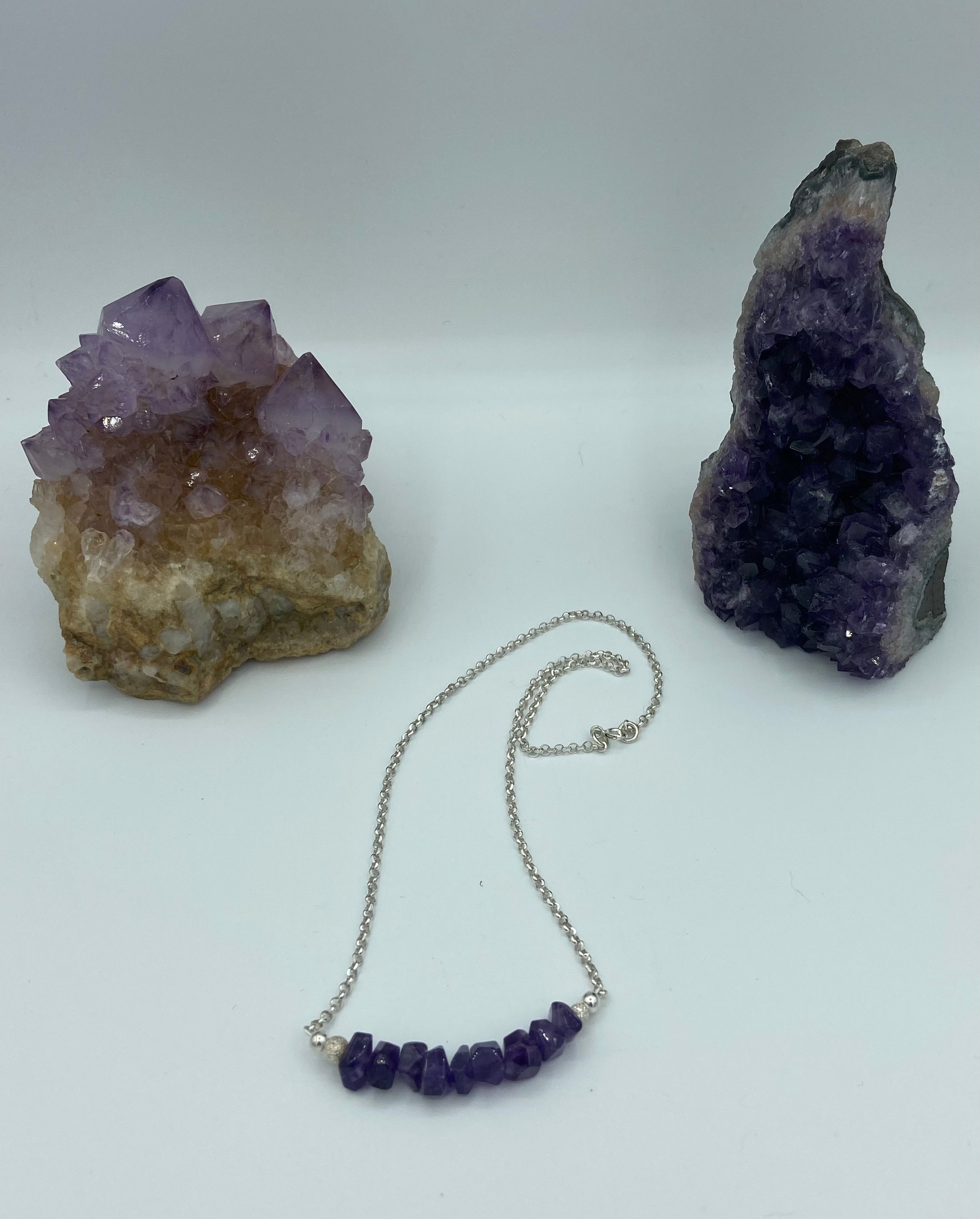 amethyst necklace styled with rocks