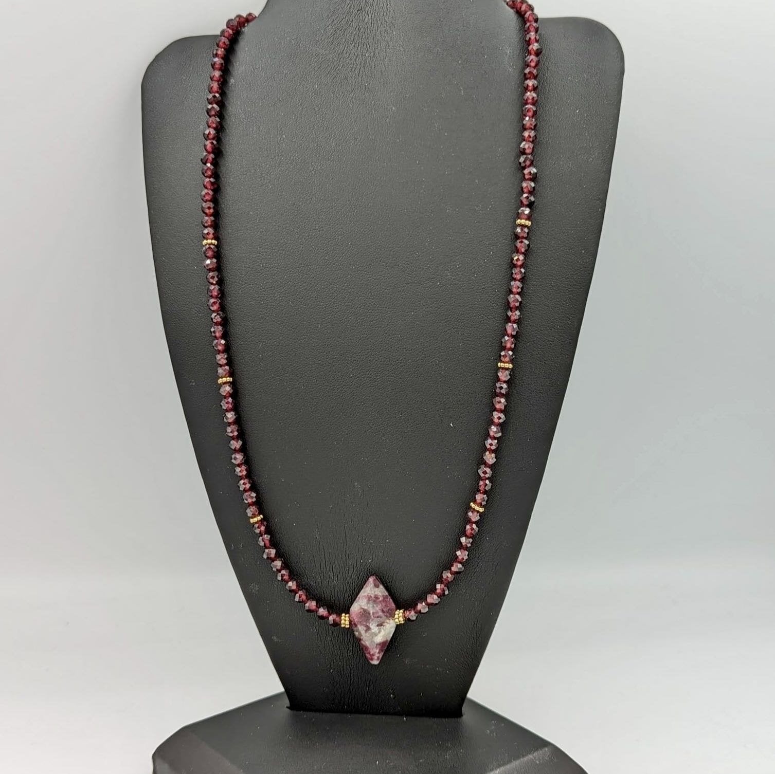 garnet necklace displayed