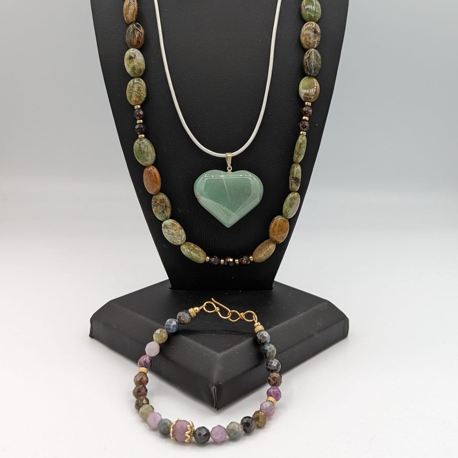 Australian opal necklace pictured with aventurine heart necklace, and sapphire bracelet and laboradite earrings