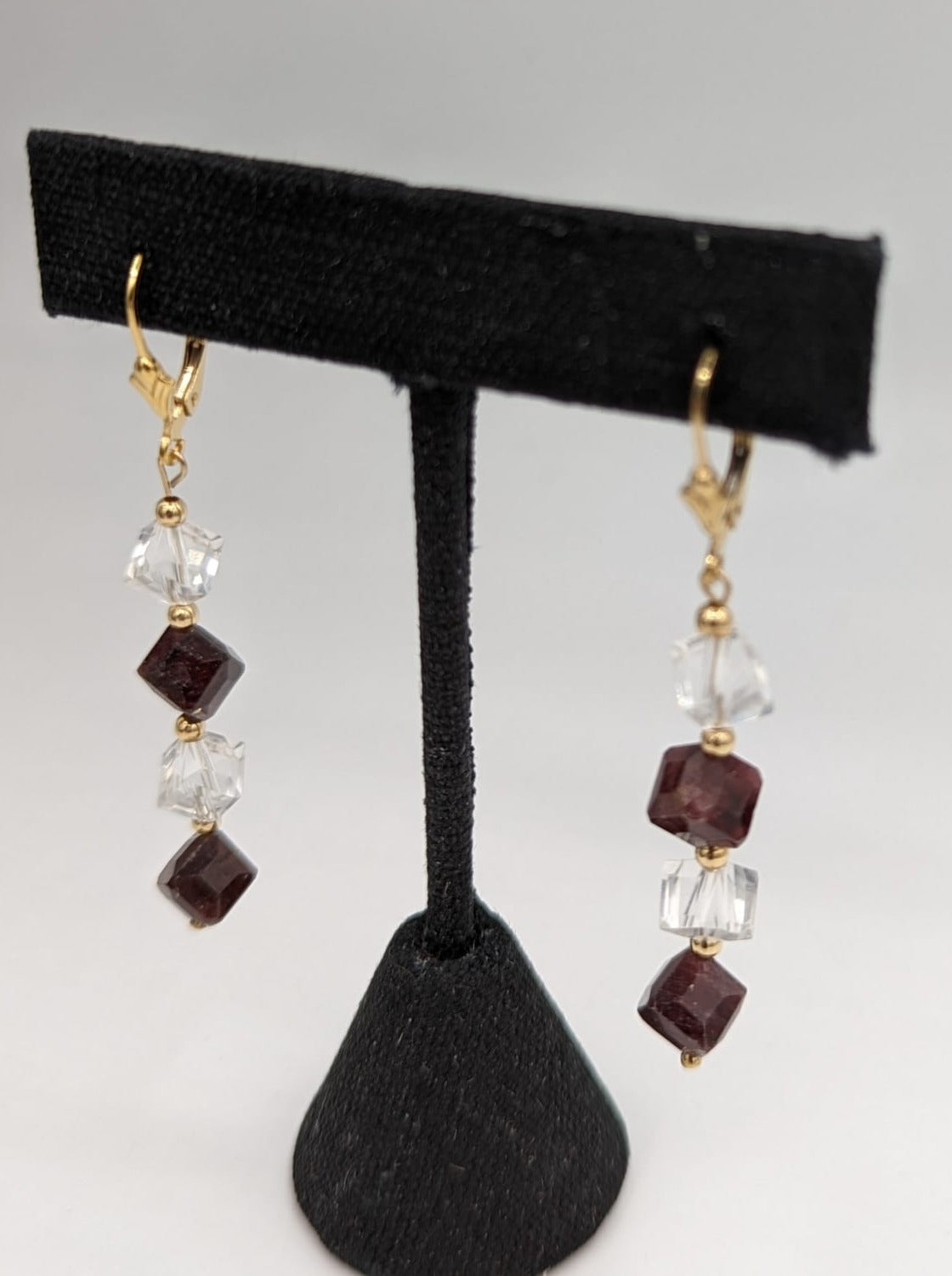 sideview of garnet and crystal earwire