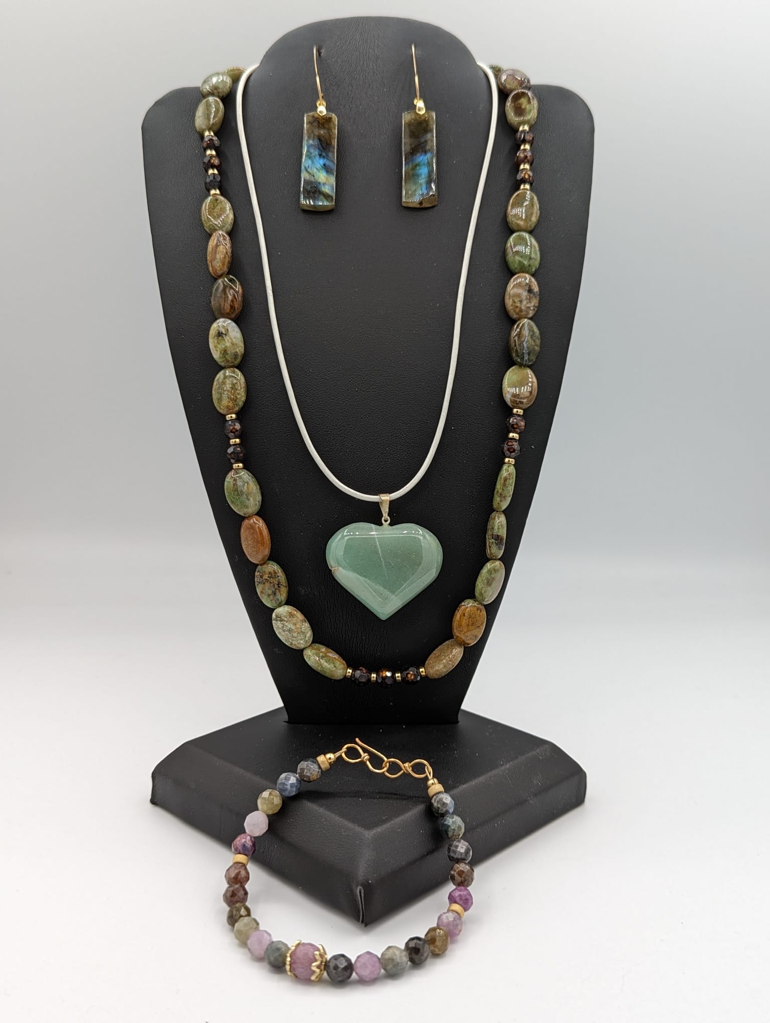 Australian opal necklace pictured with aventurine heart necklace, and sapphire bracelet and laboradite earrings